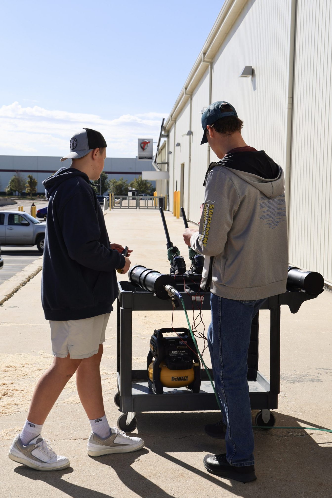 Manufacturing Day attendees preparing their paper rocks to be launched.