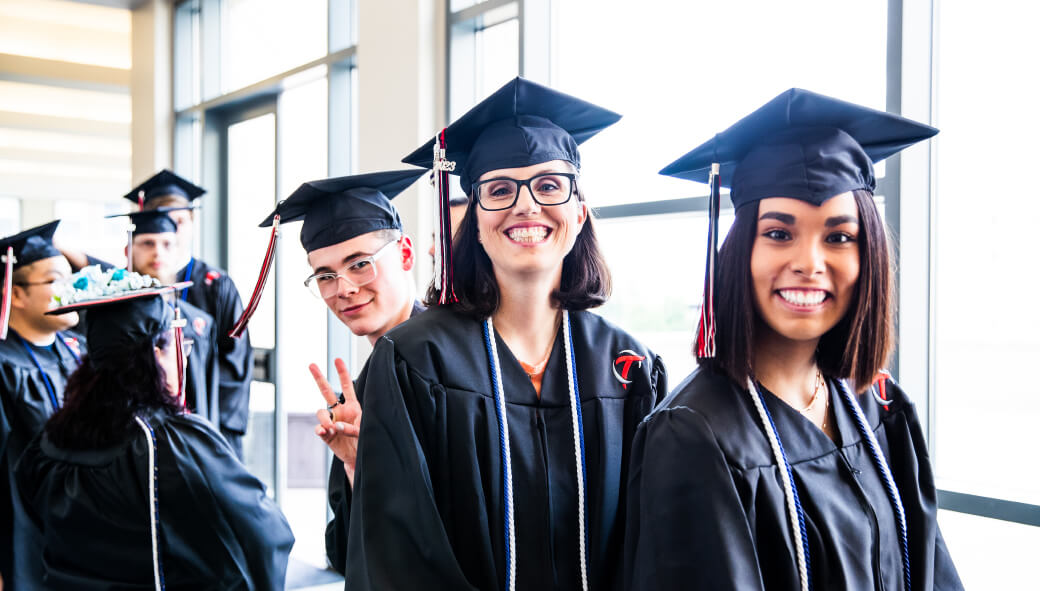 Smiling OTECH graduates