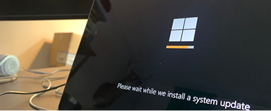 close up of laptop screen with windows booting up