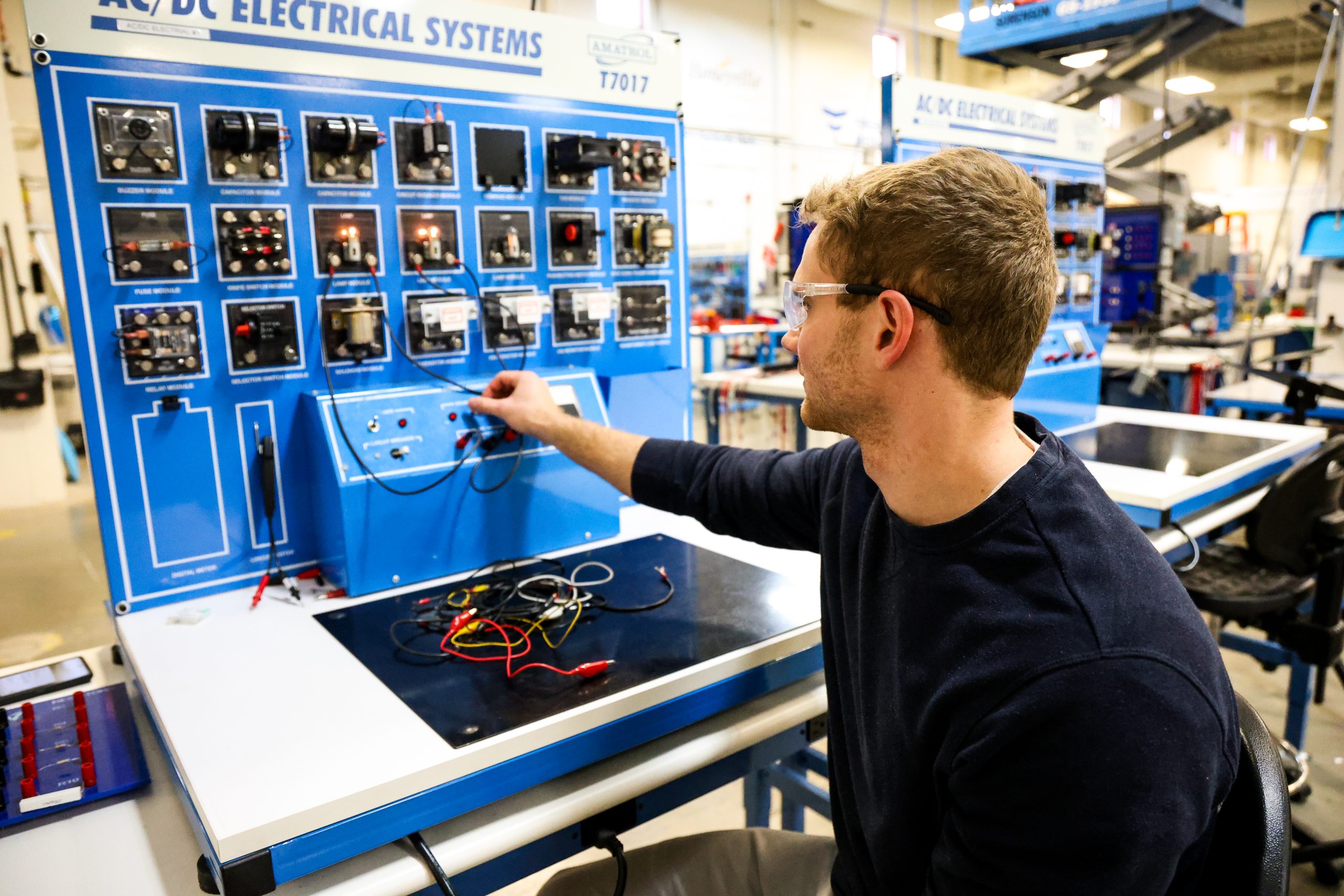 - Ogden Weber Technical College Student in OTECH's Automation Technology program working with electrical systems training panel in the Automation Technology lab at Ogden-Weber Technical College.