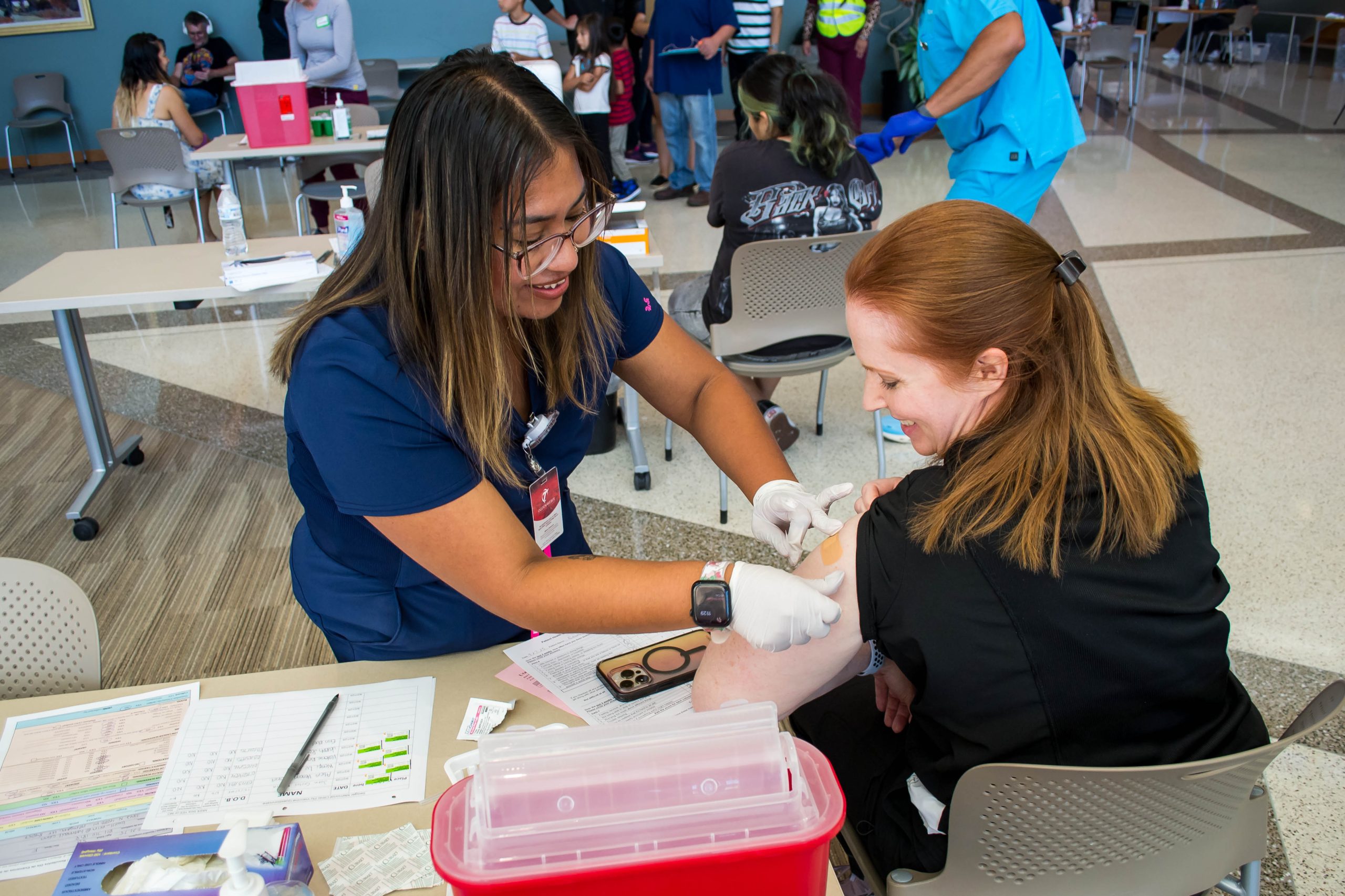Practical Nursing Admissions - Ogden Weber Technical College An Ogden-Weber Technical College healthcare student administers a vaccine to a seated community member during a free community health screening.