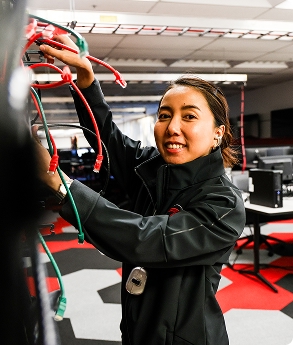networking student plugging in wires